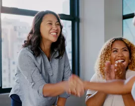 Two coworkers shaking each others hands
