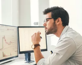 Employee reviewing engagement statistics on computer