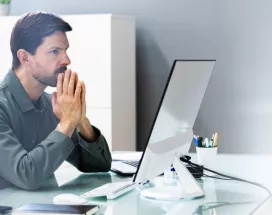 An upset employee sitting at their desk