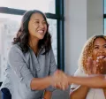 Two coworkers shaking each others hands