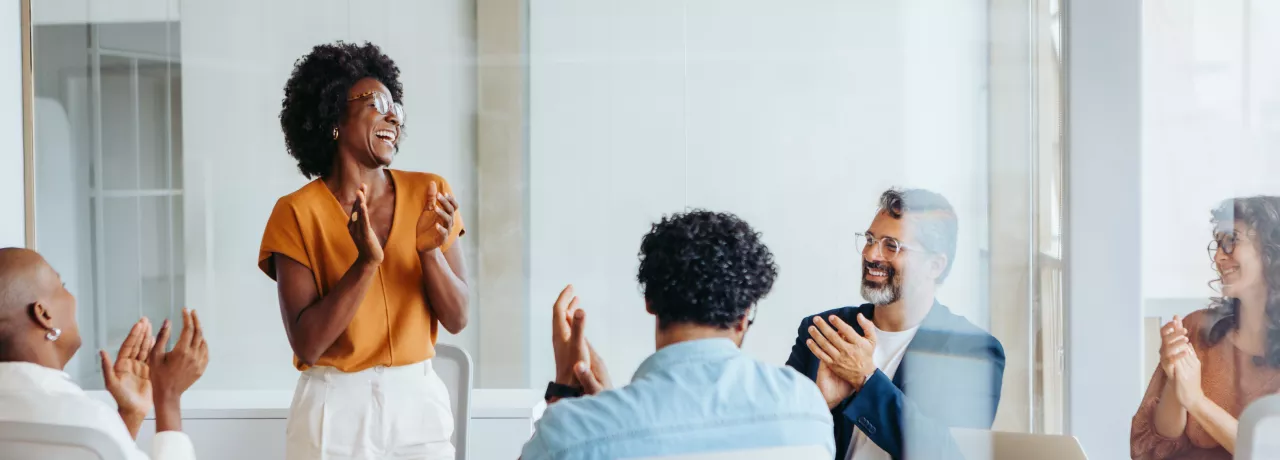 Team celebrating around a table