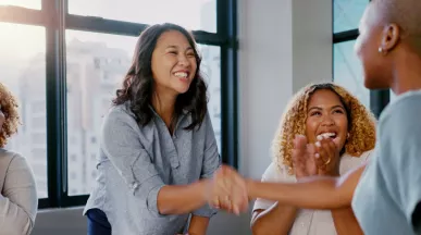 Two coworkers shaking each others hands