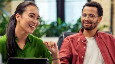 Four coworkers talking in an company lounge
