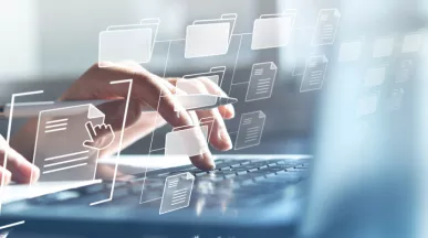 Hands typing on a computer with transparent icons hovering in front