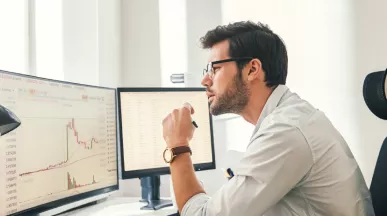 Employee reviewing engagement statistics on computer