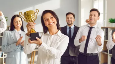 A group of happy employees participating in an employee incentive program that boosts employee morale, employee satisfaction and employee retention