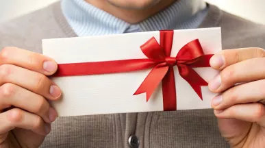 Employee holding their gift from work