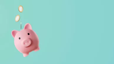 Shows a piggy bank with coins floating above it